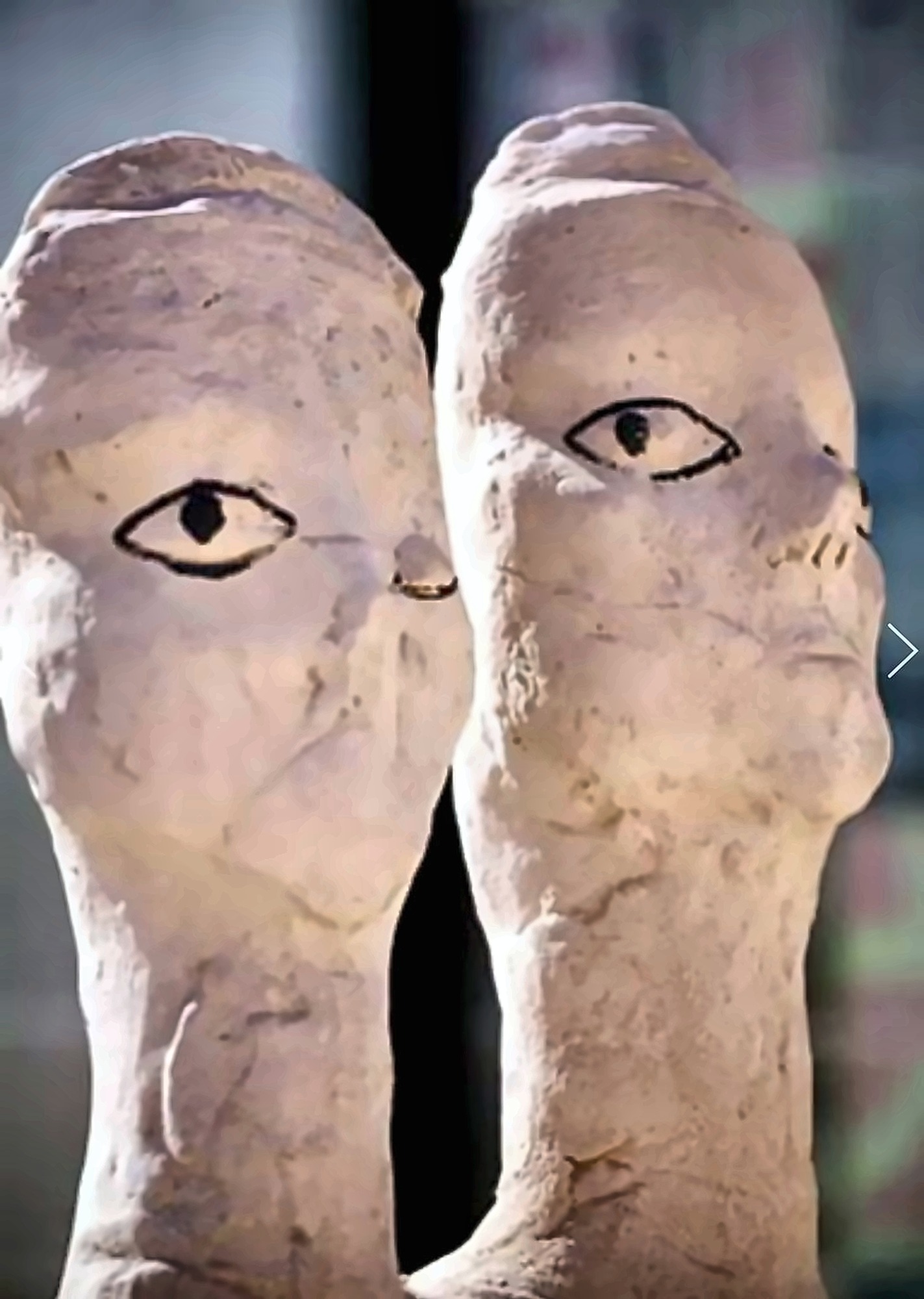 A pair of limestone figures by Hazem Al-Zubi.