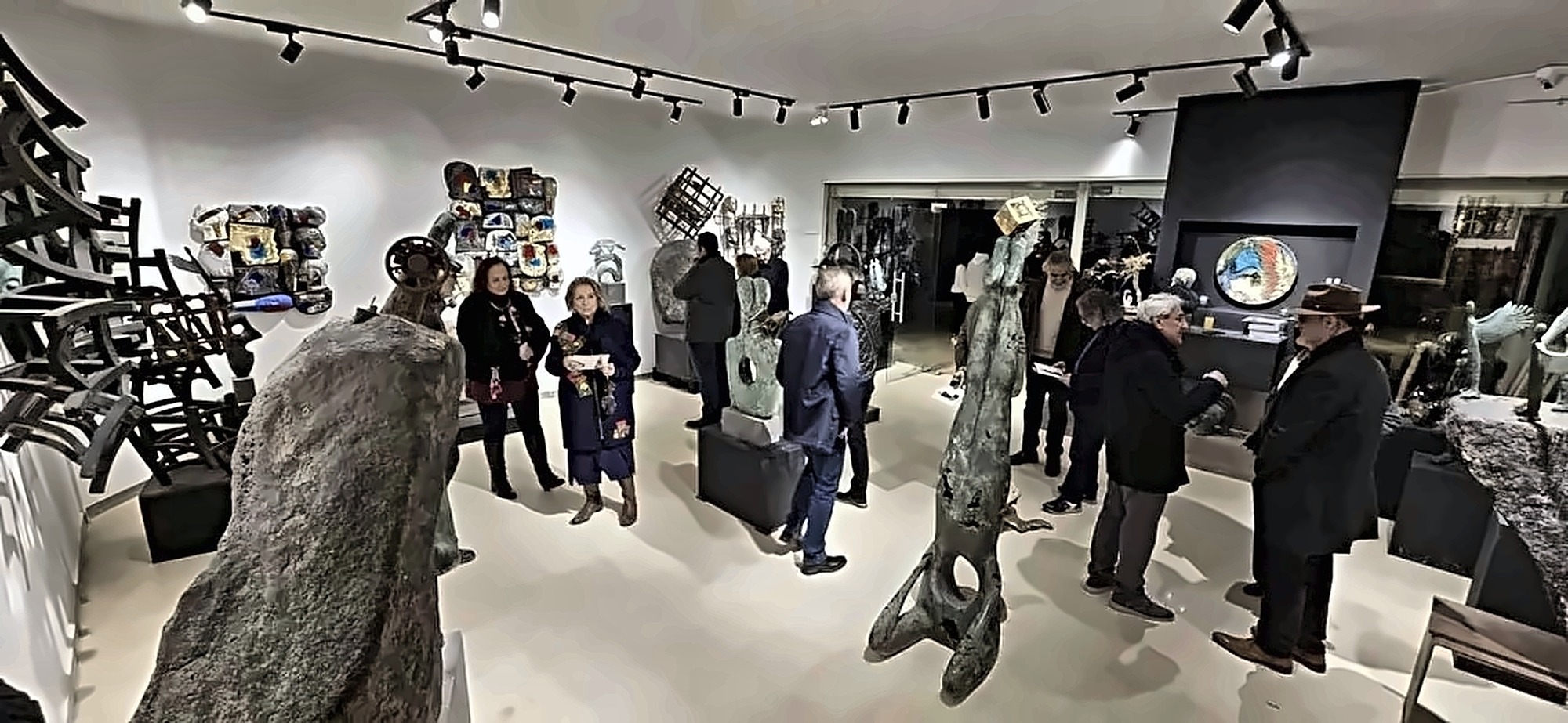 People and sculptures at the opening.