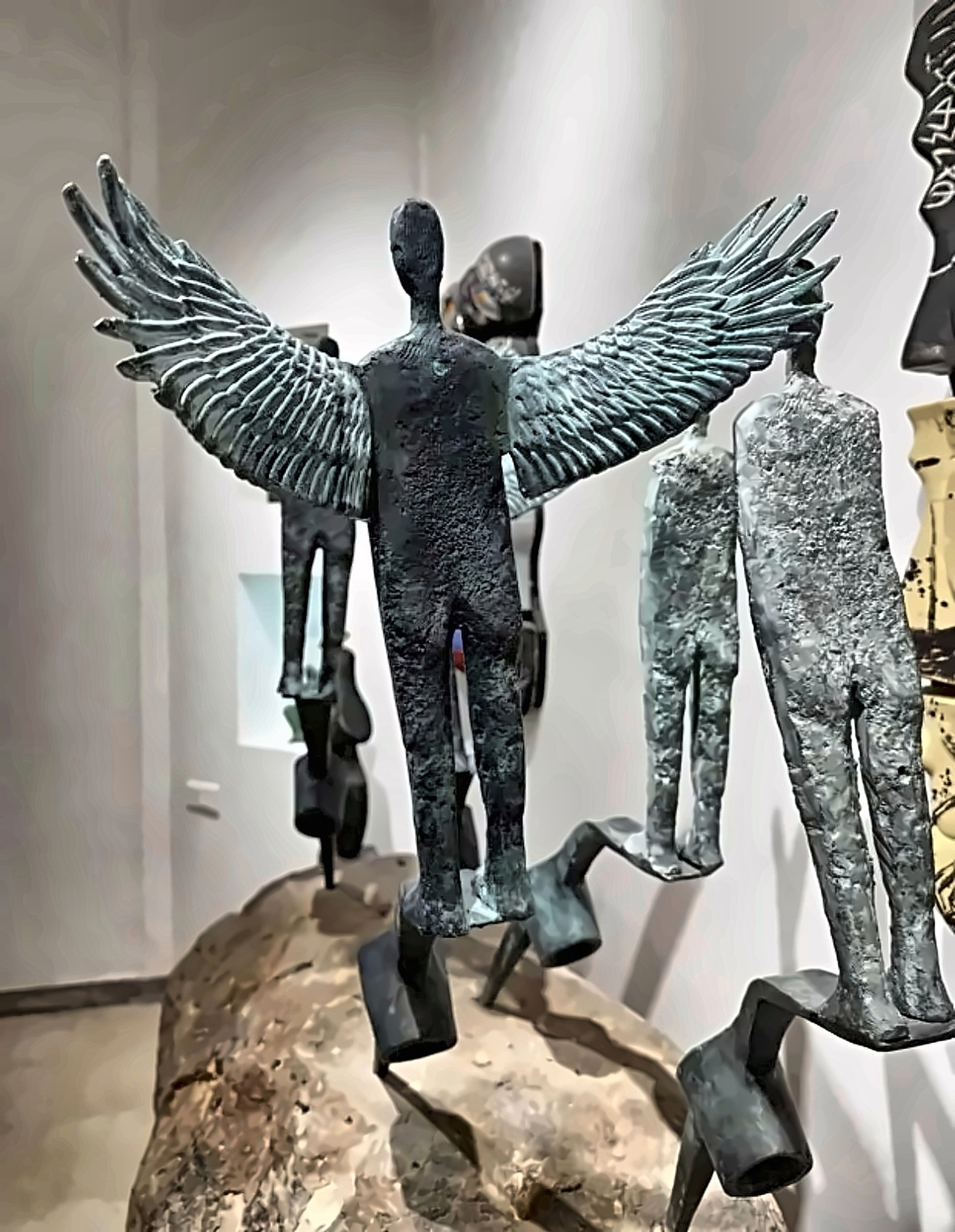 A winged sculptural group.